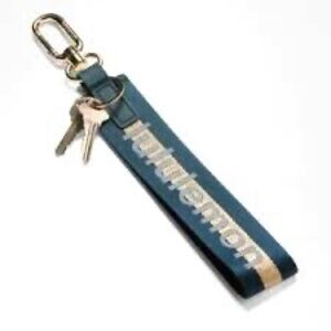 NWT Lululemon Never Lost Keychain Color Grey Gold/Emerald Green